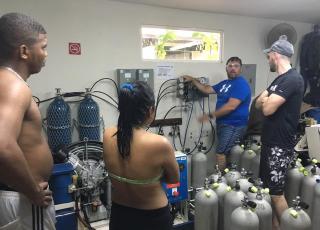 Students receive on-site compressor training at Smithsonian Research Station in Bocas del Toro, Panama