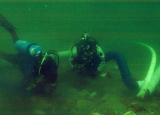 Divers excavate an archaeological site