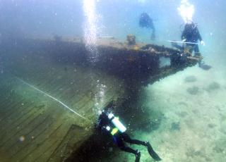 Scientific Diving Students measure a shipwreck