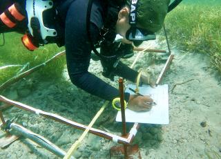 NMAAHC Archaeologist Gabrielle Miller diving at a Slave Wrecks Project at one of the largest sites of trans-oceanic enslavement on the African Coast.